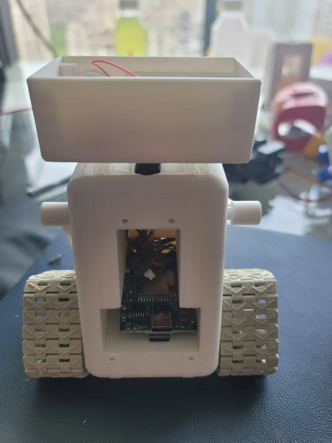 Early light-colored physical robot enclosure prototype
