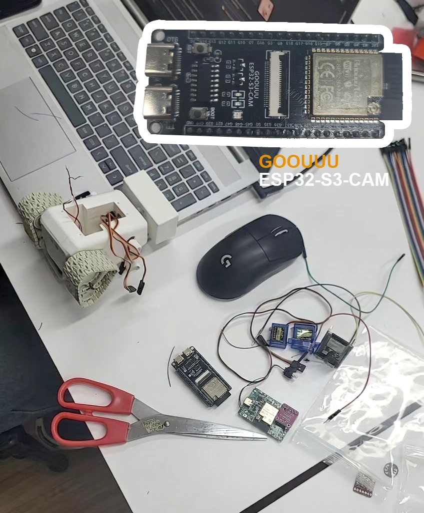 Early robot prototype connected to ESP32 development boards and servos with jumper wires